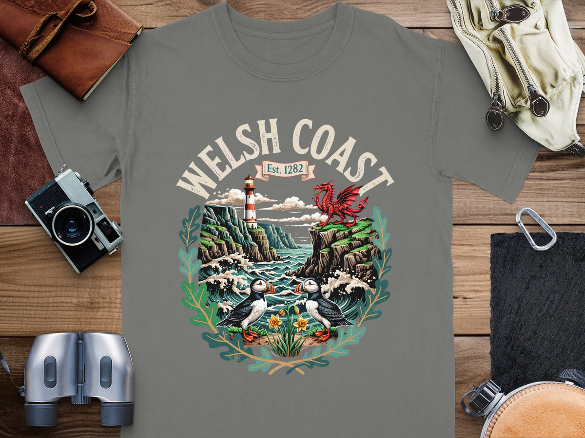 T-shirt design with "WELSH COAST Est. 1282" and a Welsh dragon, lighthouse, and puffins.
