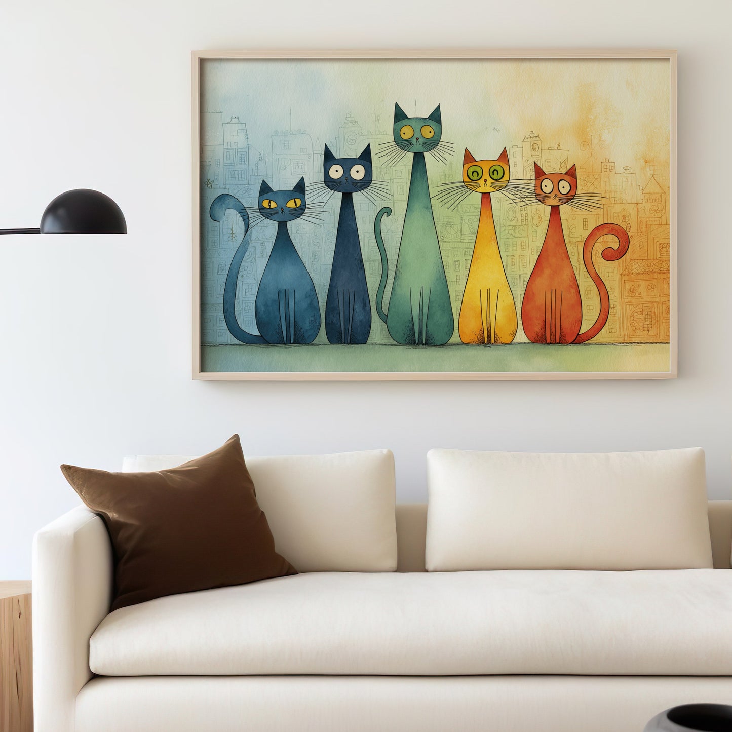 Five colorful cartoon cats sit in a row above a couch and lamp.
