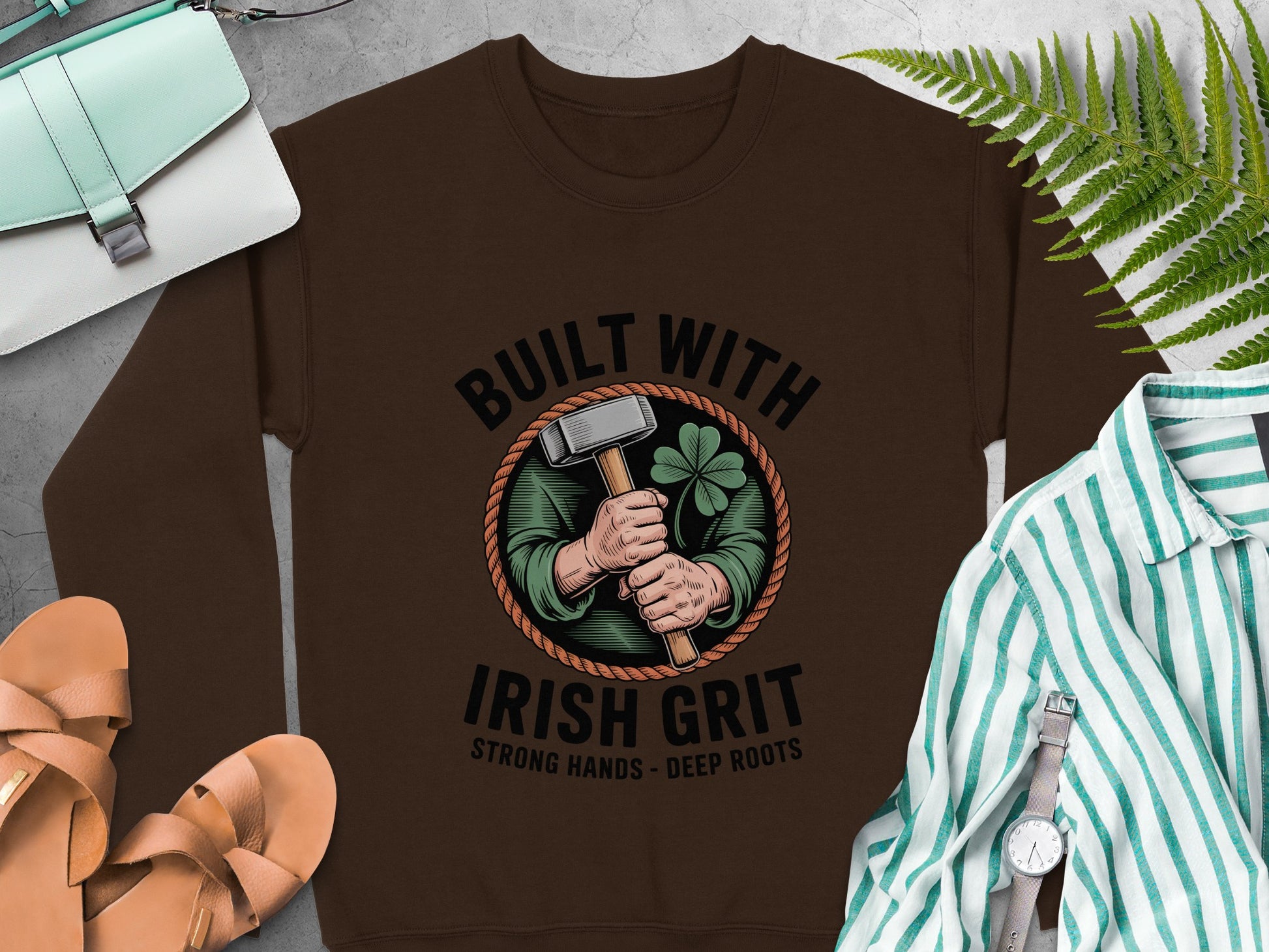 "Built with Irish Grit" and hammer and clover graphic on Dark Chocolate sweatshirt