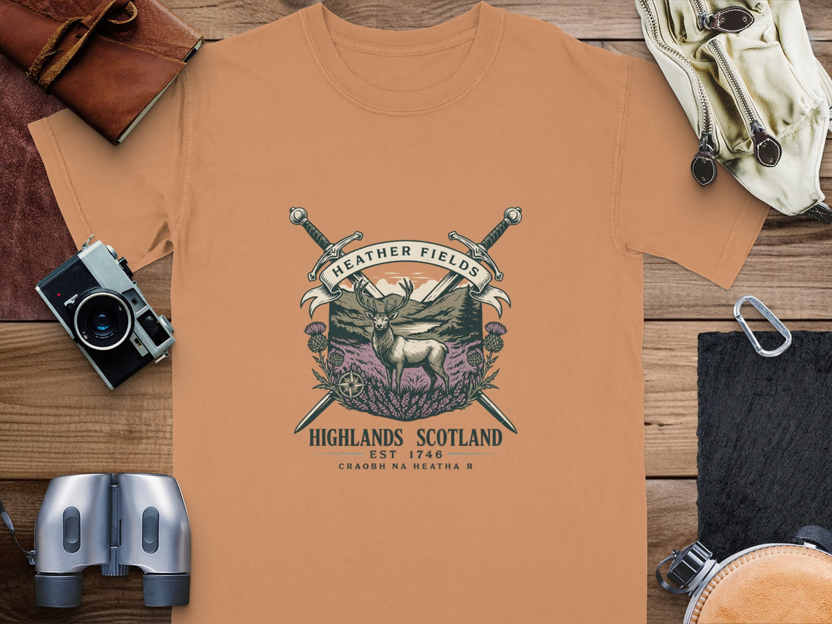 T-shirt with a Highland deer, thistles, and crossed swords graphic.