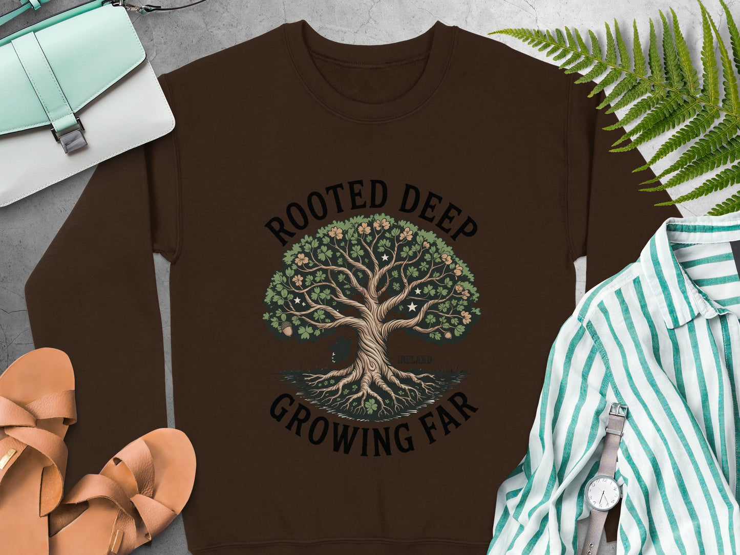 "Rooted Deep Growing Far" tree graphic and "Ireland" text on Dark Chocolate sweatshirt