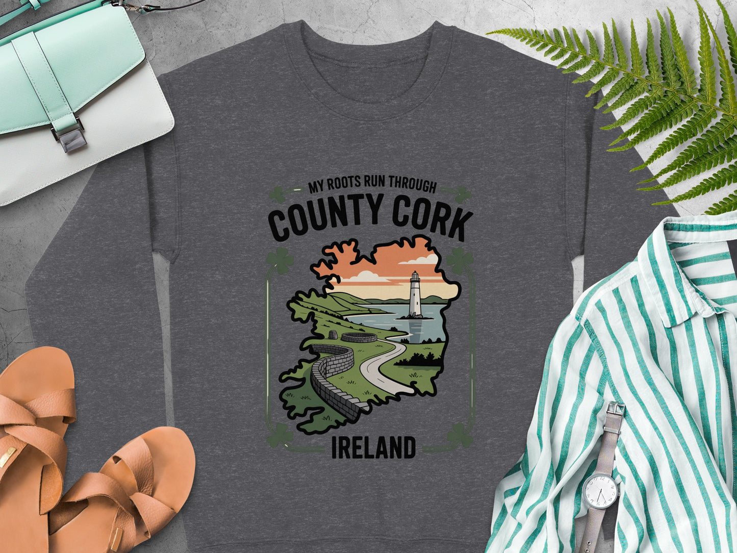 "My Roots Run Through County Cork Ireland" graphic and lighthouse illustration on Dark Heather sweatshirt