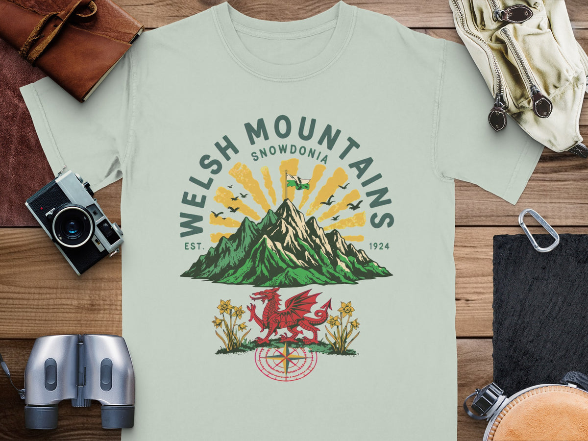 T-shirt with Welsh Mountains Snowdonia graphic, red dragon, daffodils, and compass.