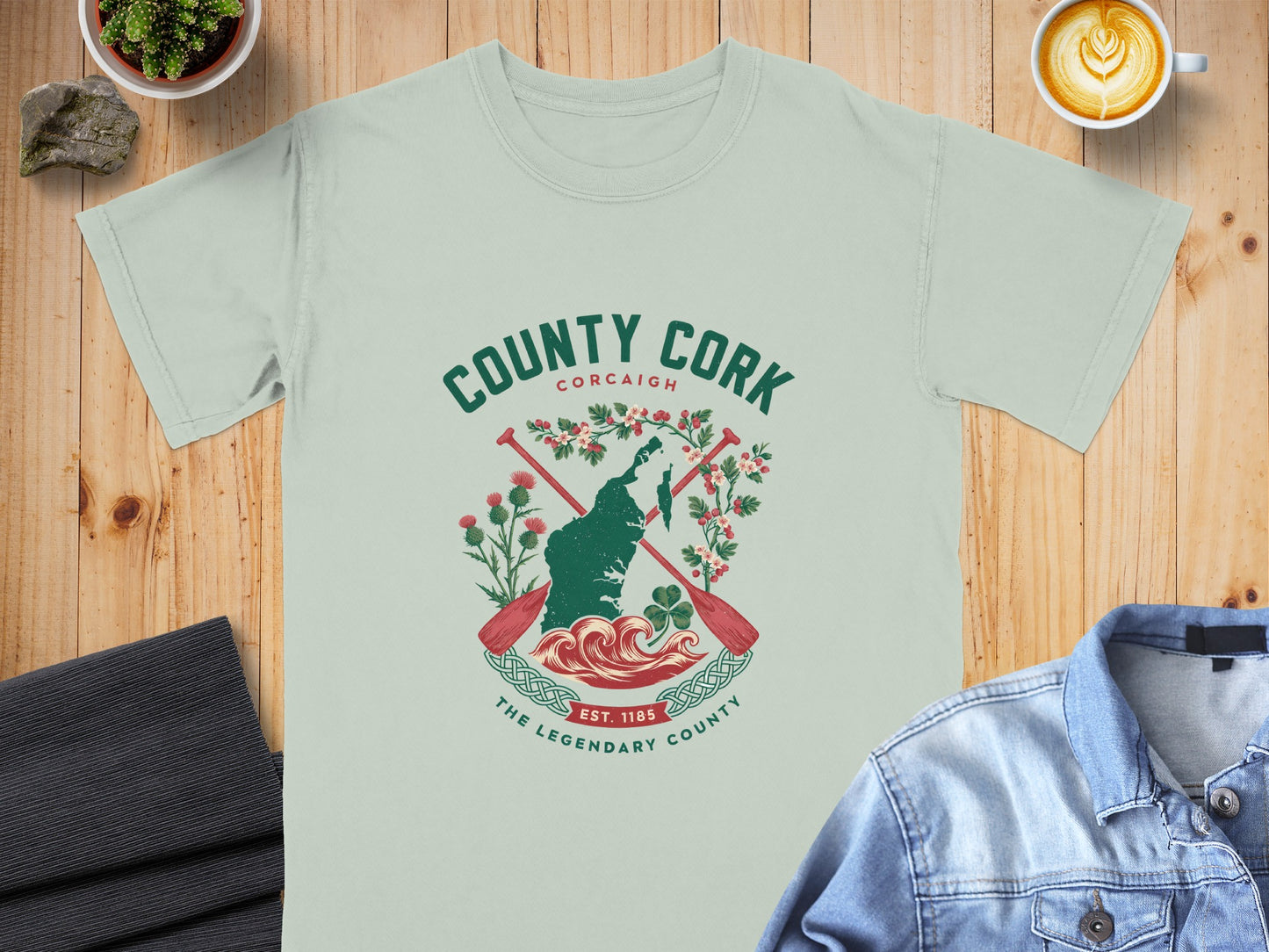 County Cork map graphic with oars, waves, and text EST. 1185.