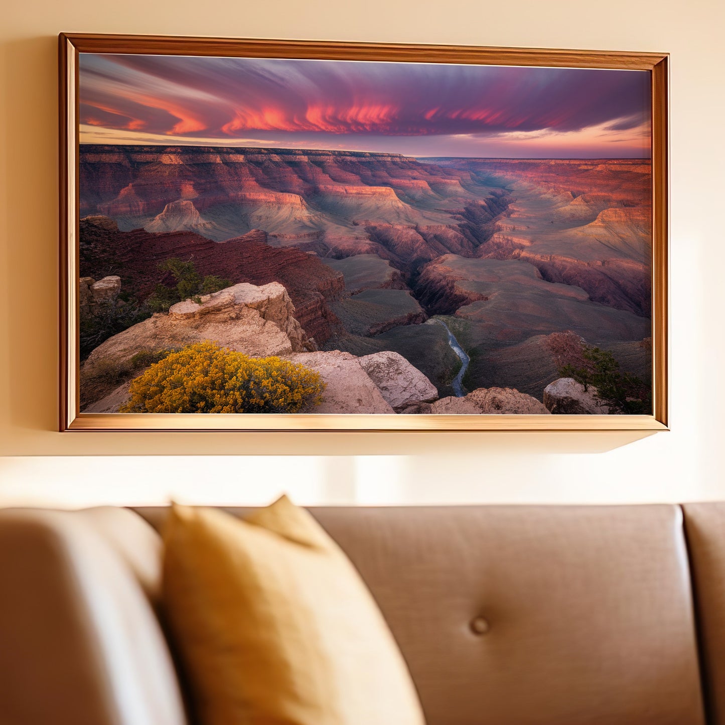 Grand Canyon landscape at sunset with dramatic clouds and river below.