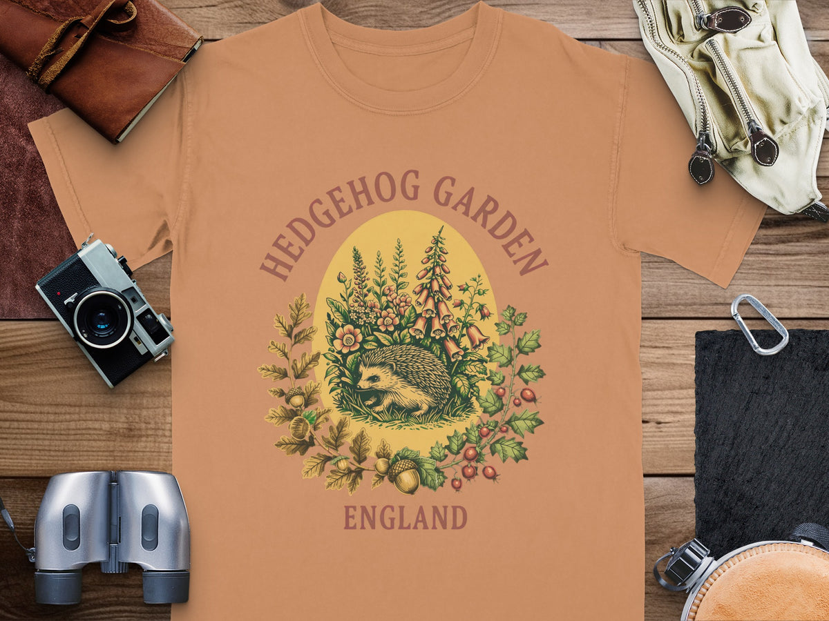 T-shirt with a hedgehog garden illustration, text "HEDGEHOG GARDEN ENGLAND".