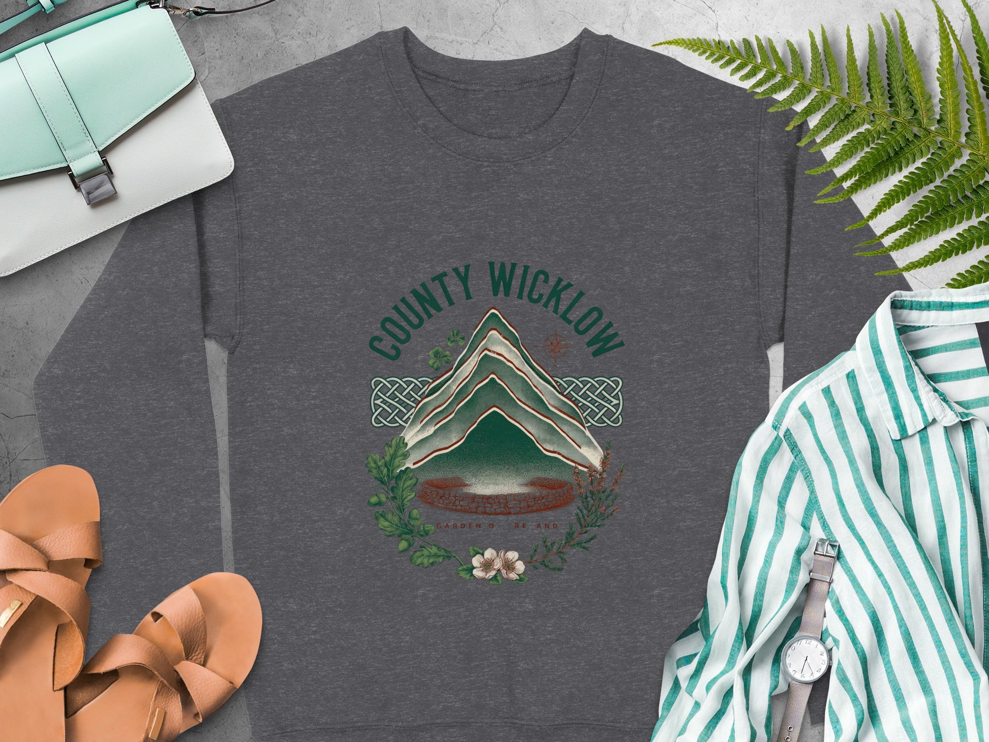 Dark grey sweatshirt with "County Wicklow Garden of Ireland" graphic and nature elements.