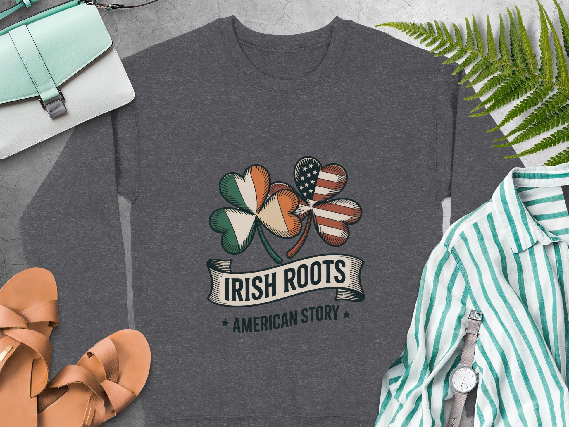 Irish and American flag shamrock and "Irish Roots American Story" text on Dark Heather sweatshirt