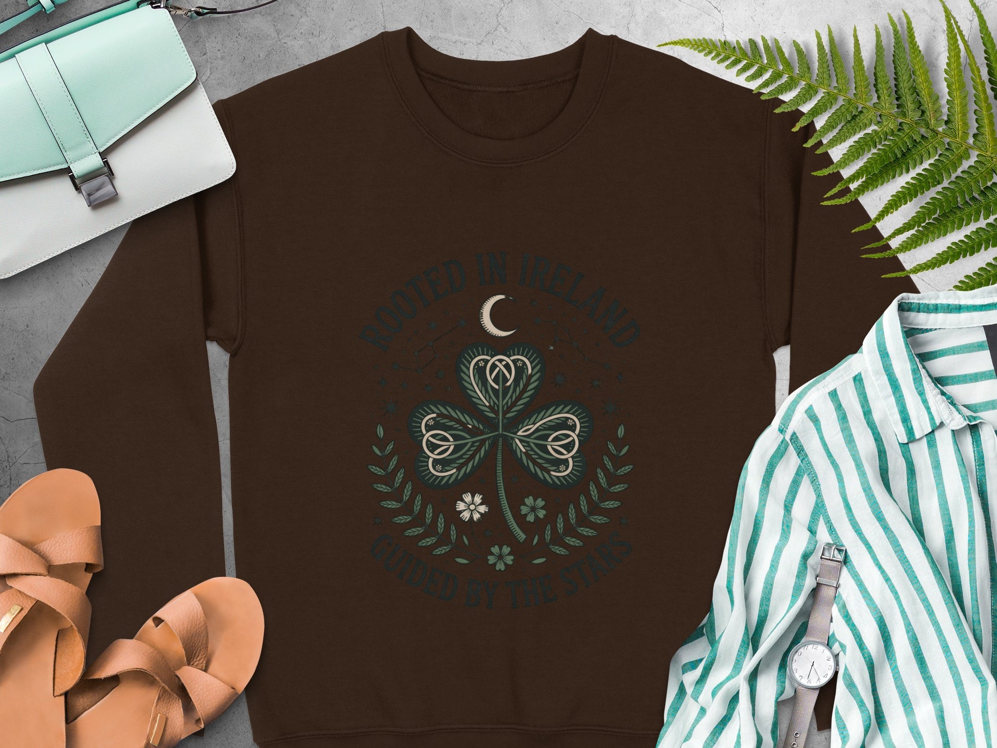 "Rooted in Ireland" and shamrock graphic on Dark Chocolate sweatshirt