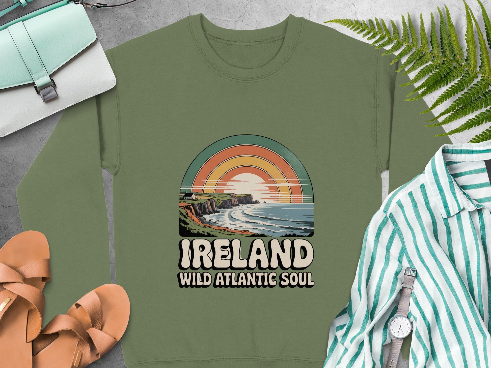 "IRELAND WILD ATLANTIC SOUL" graphic and coastal sunset design on Military Green sweatshirt