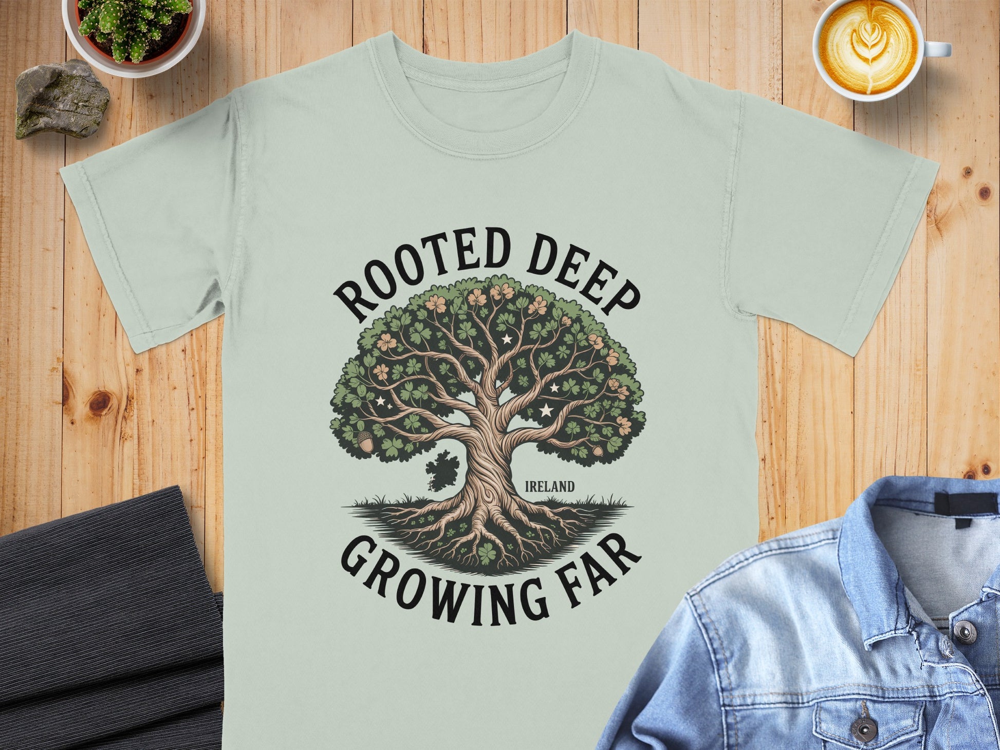 T-shirt with "Rooted Deep Growing Far" text and Ireland map graphic.