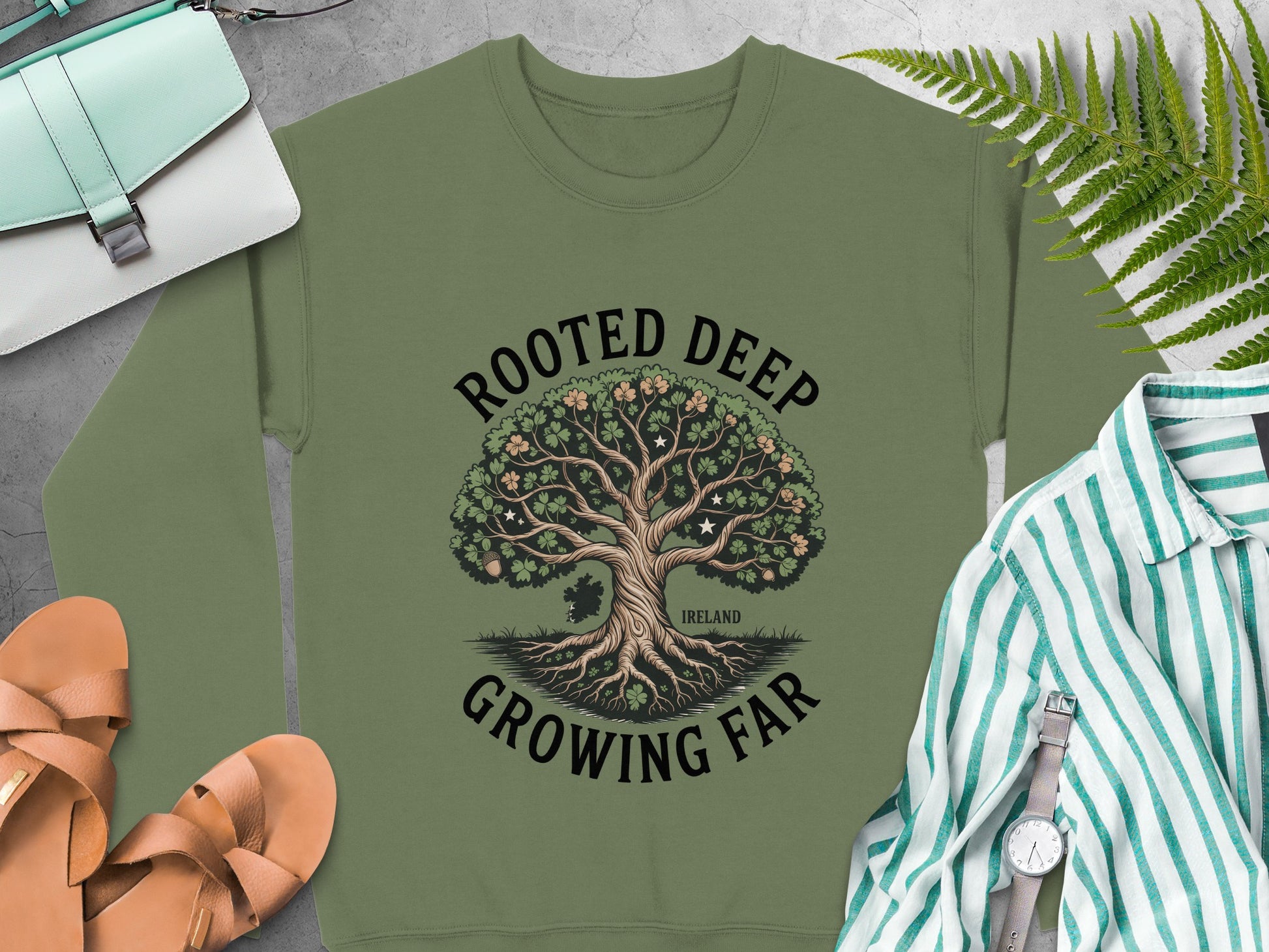 Tree graphic and text "ROOTED DEEP GROWING FAR" and "IRELAND" on Military Green sweatshirt