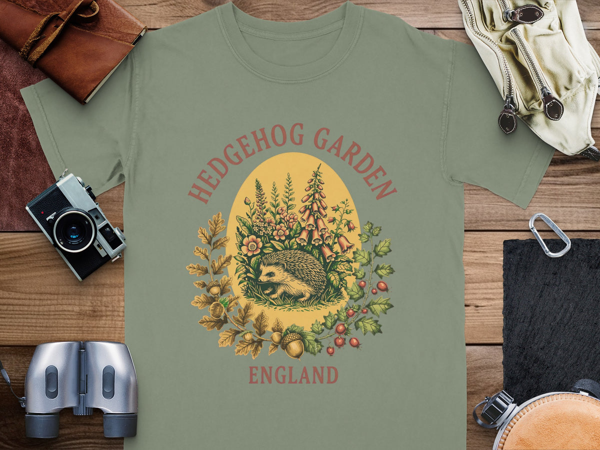 T-shirt with a vintage hedgehog, flowers, and "Hedgehog Garden England" text.