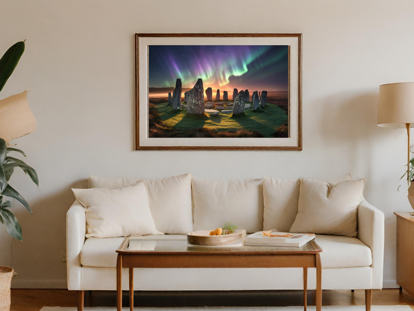 Framed painting of ancient standing stones under a colorful aurora borealis.