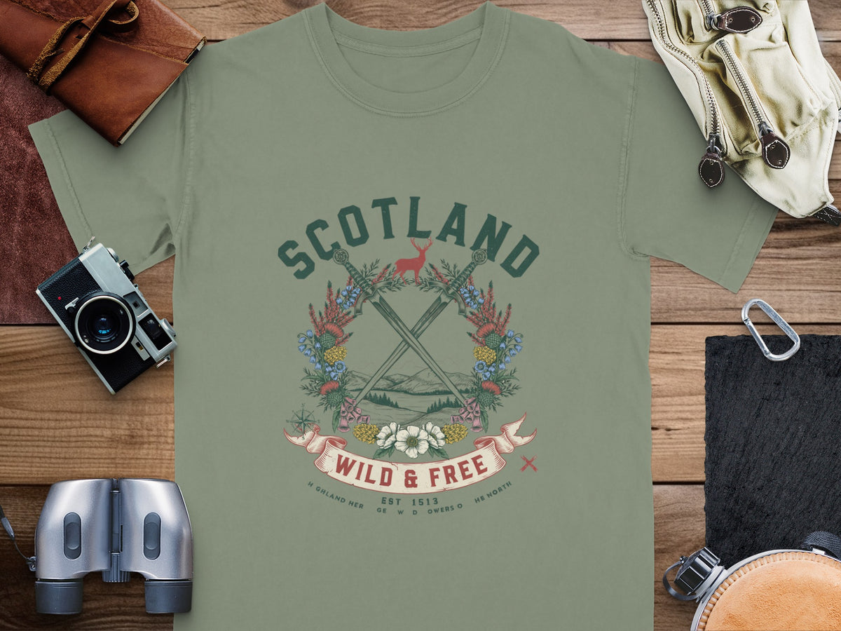 Green t-shirt with "SCOTLAND WILD & FREE" graphic and Scottish imagery.