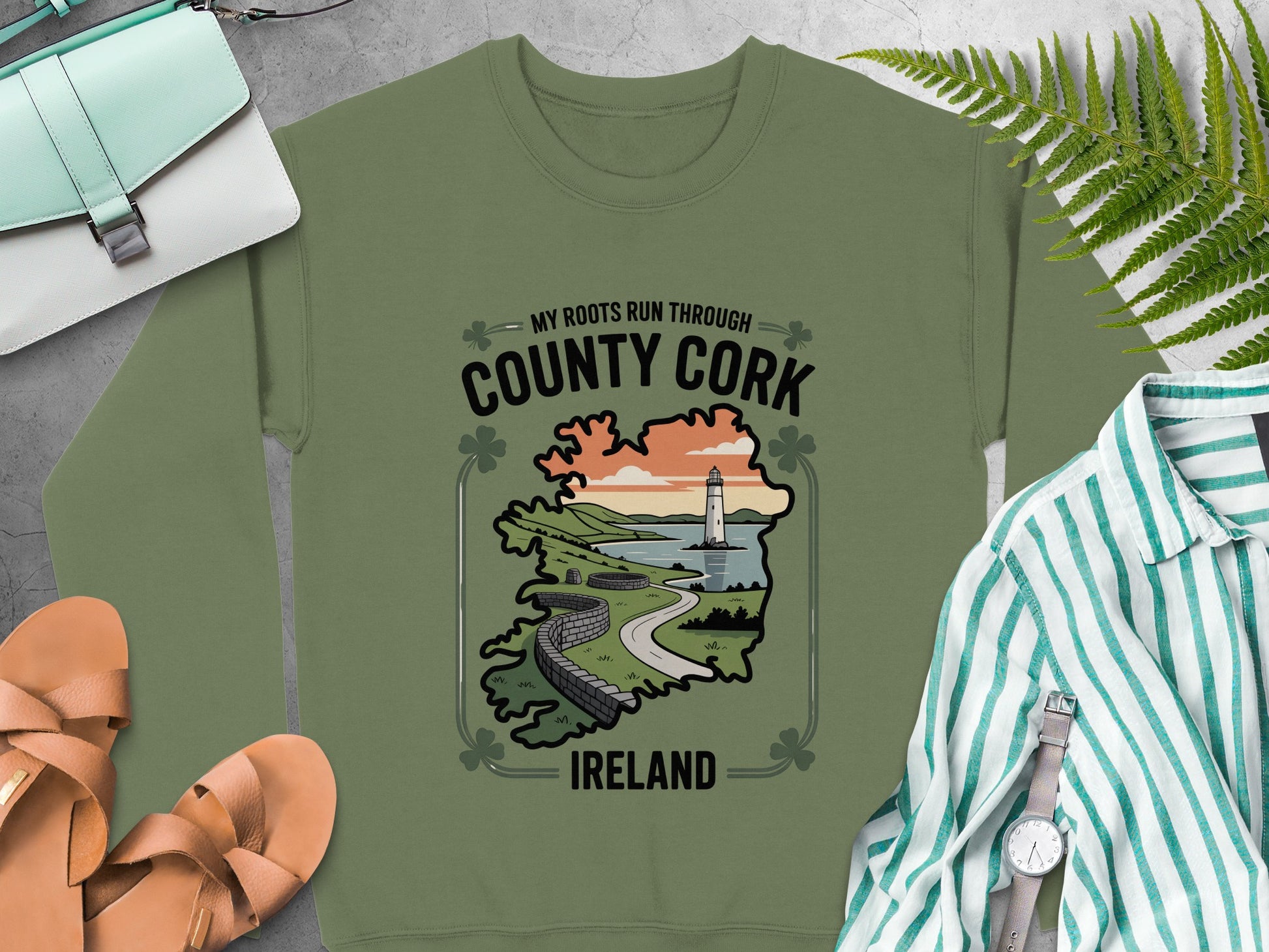 "County Cork, Ireland" text and a scenic lighthouse illustration on Military Green sweatshirt