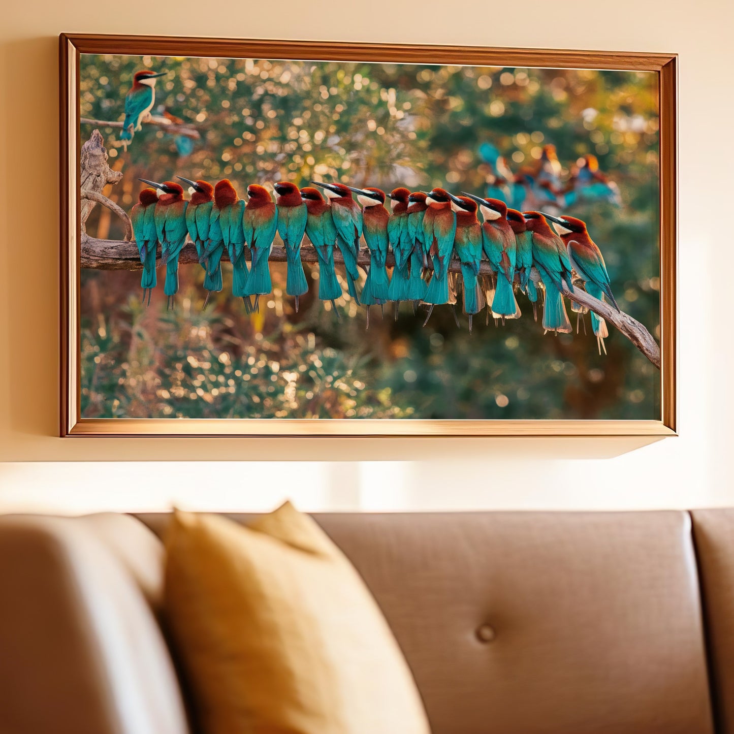 Framed art of a flock of colorful bee-eater birds perched on a branch.