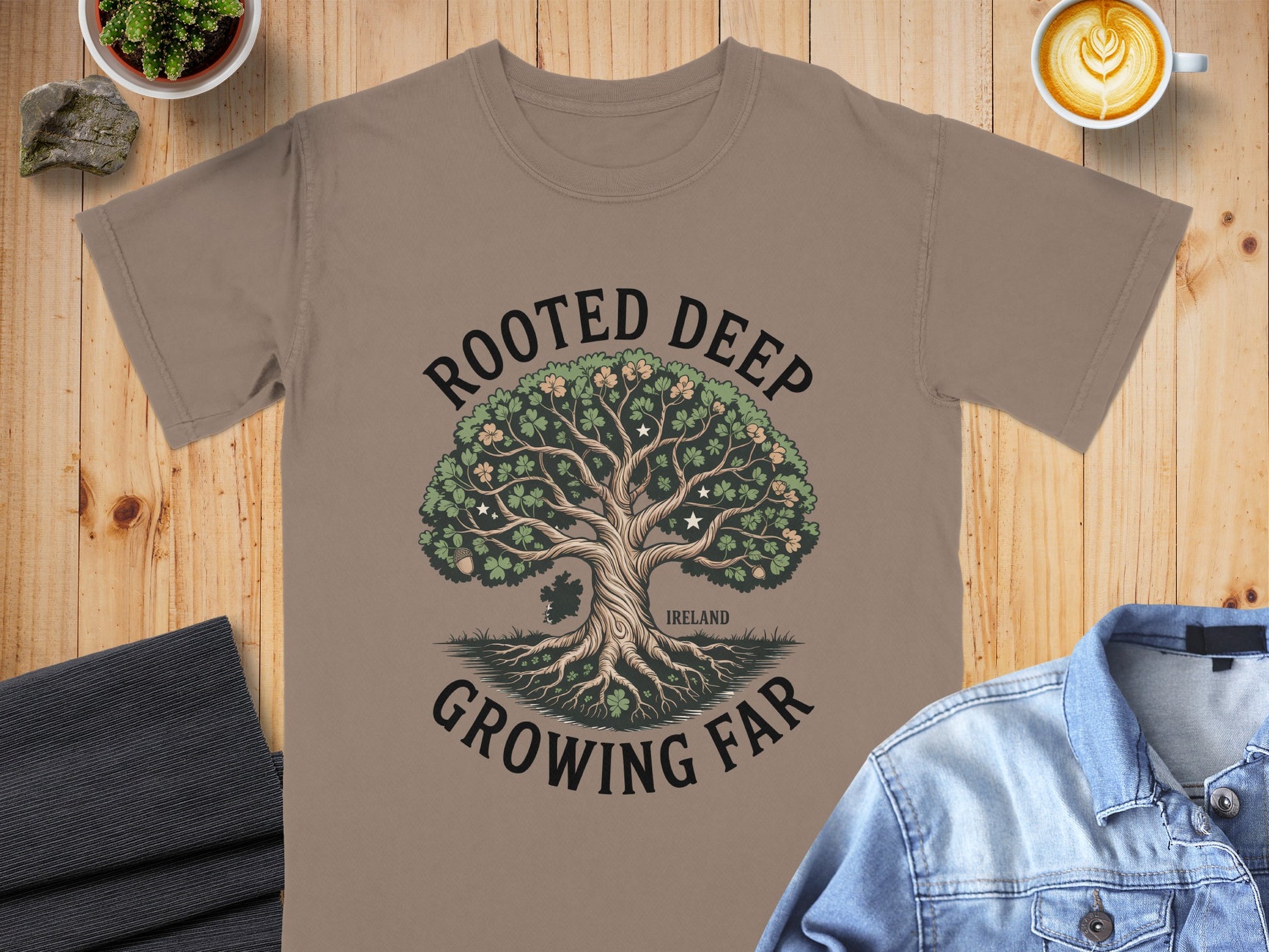 T-shirt with a tree graphic and text "ROOTED DEEP GROWING FAR IRELAND".