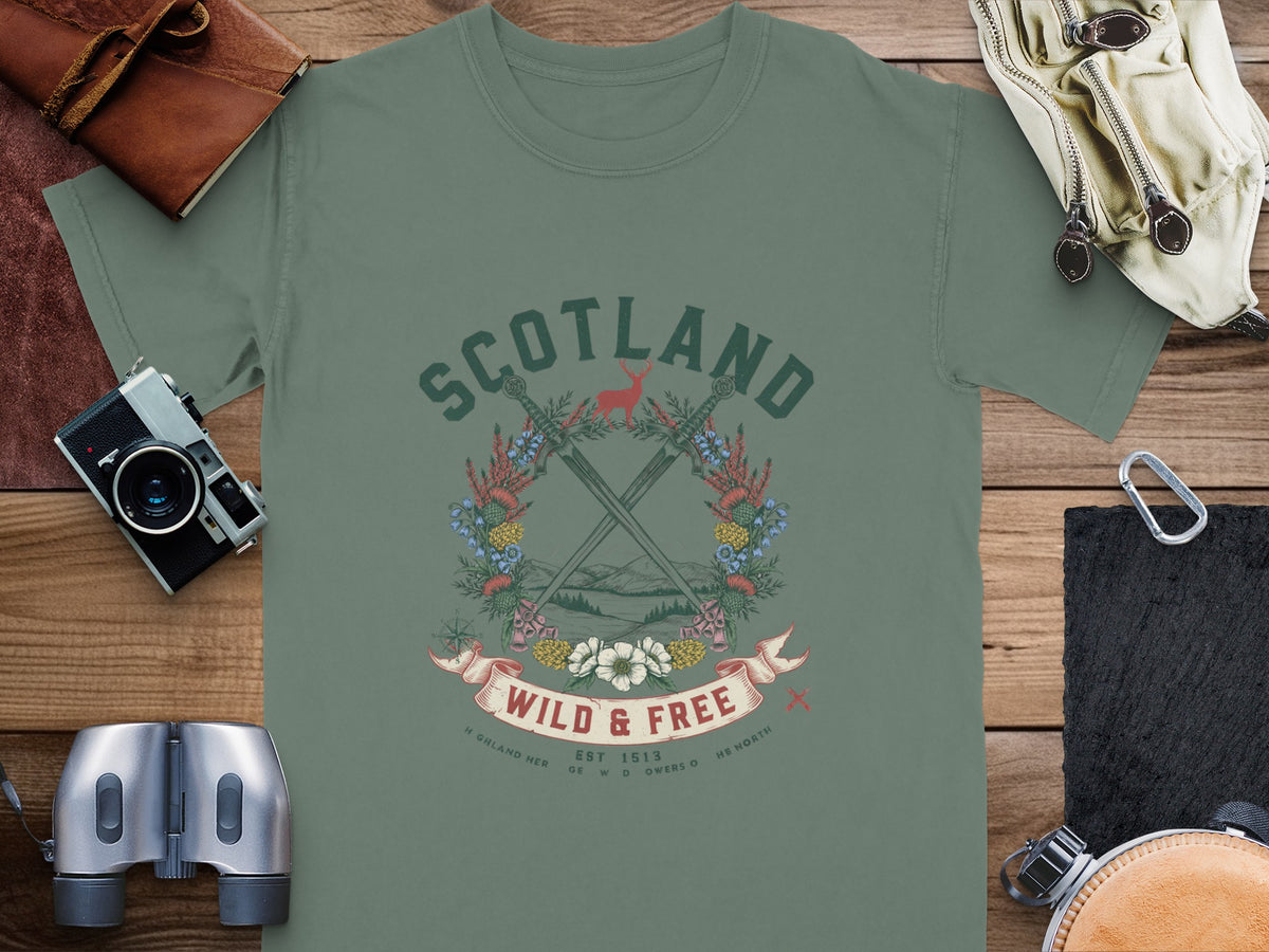Green t-shirt with "SCOTLAND WILD & FREE" graphic featuring crossed swords and a deer.