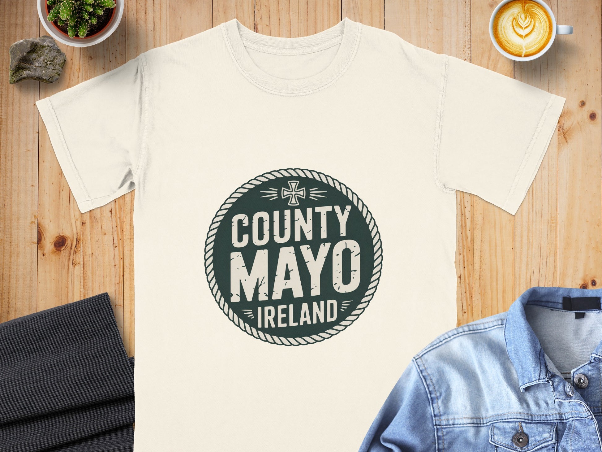 Cream t-shirt with dark green County Mayo Ireland circular distressed graphic.