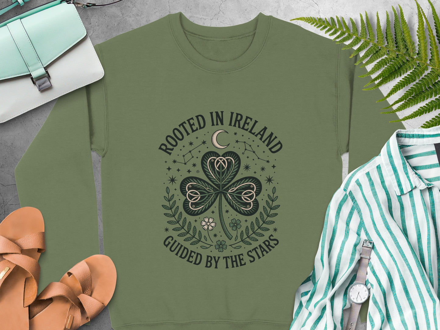 Shamrock design and text "ROOTED IN IRELAND GUIDED BY THE STARS" on Military Green sweatshirt