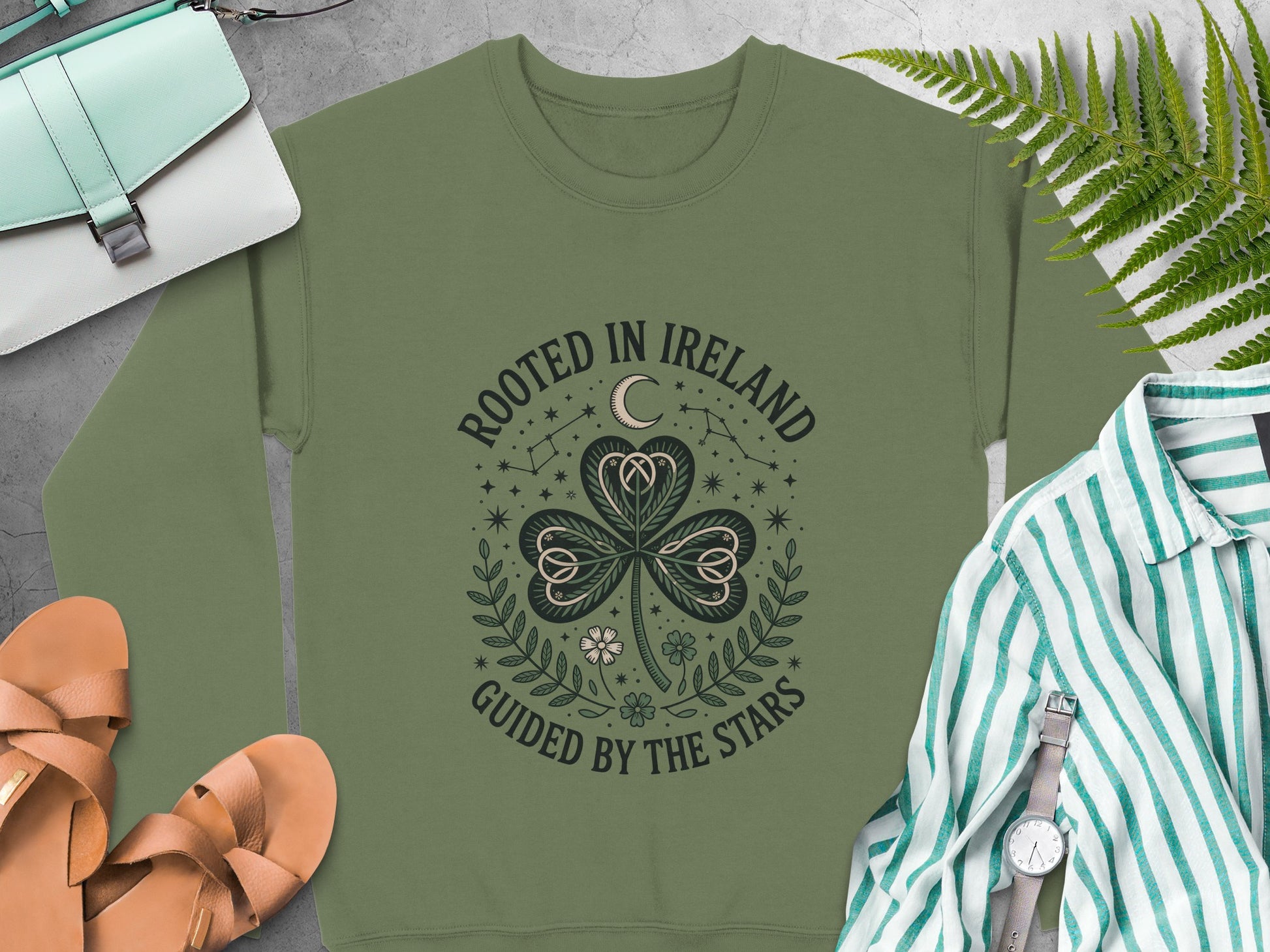 Shamrock design and text "ROOTED IN IRELAND GUIDED BY THE STARS" on Military Green sweatshirt