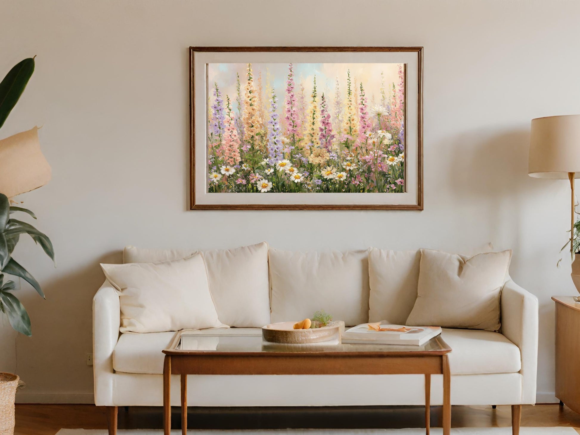 Floral painting above a white sofa with a wooden coffee table.
