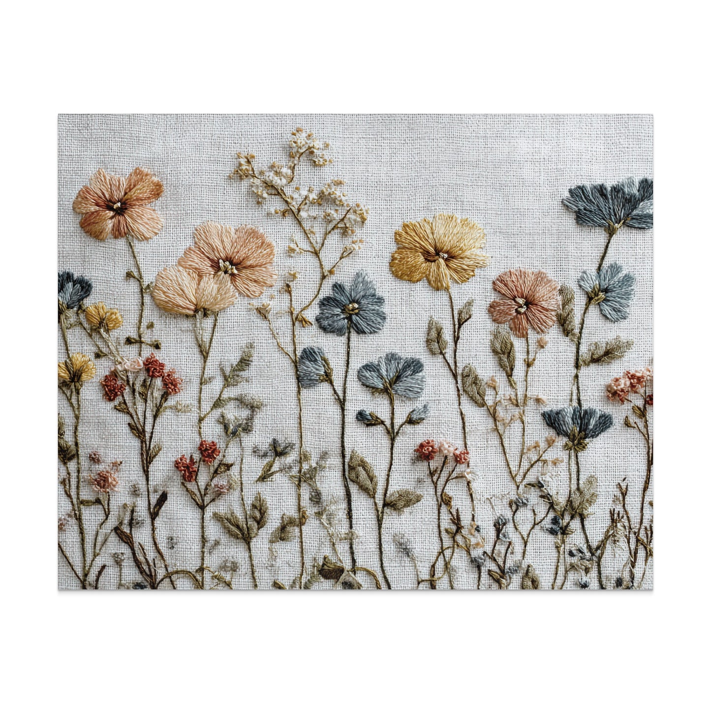 Embroidered wildflowers in muted peach, blue, and yellow on a white linen background.