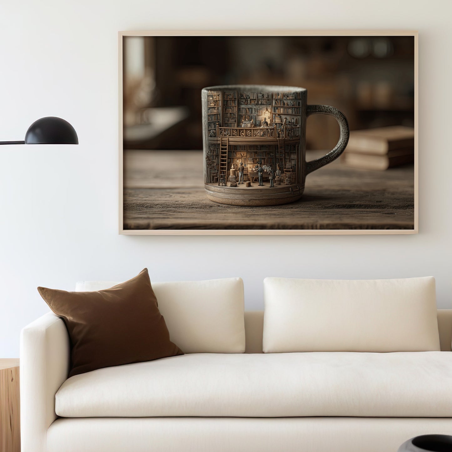 Mug with tiny library inside, framed and hung above a couch.