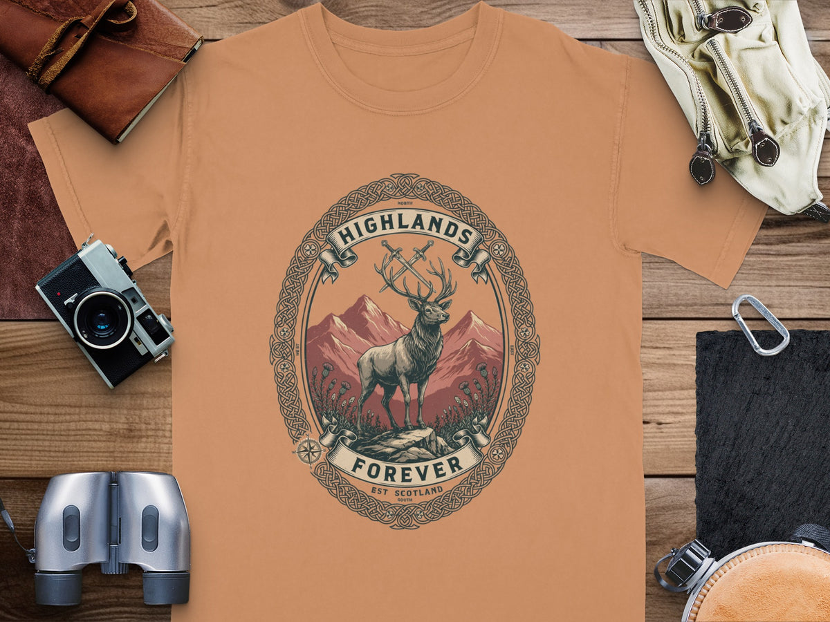 T-shirt featuring a deer, swords, mountains, and text "Highlands Forever Est Scotland".