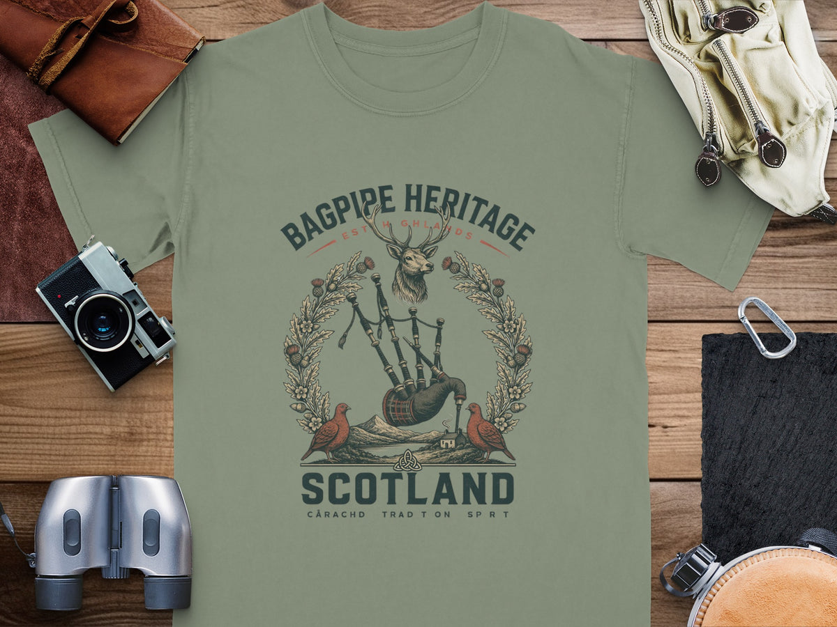 T-shirt graphic with bagpipes, deer, birds, and "Scotland" text.