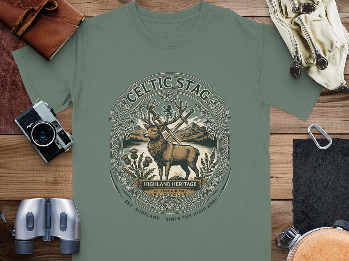 Green t-shirt with Celtic stag design, swords, thistles, and mountains.