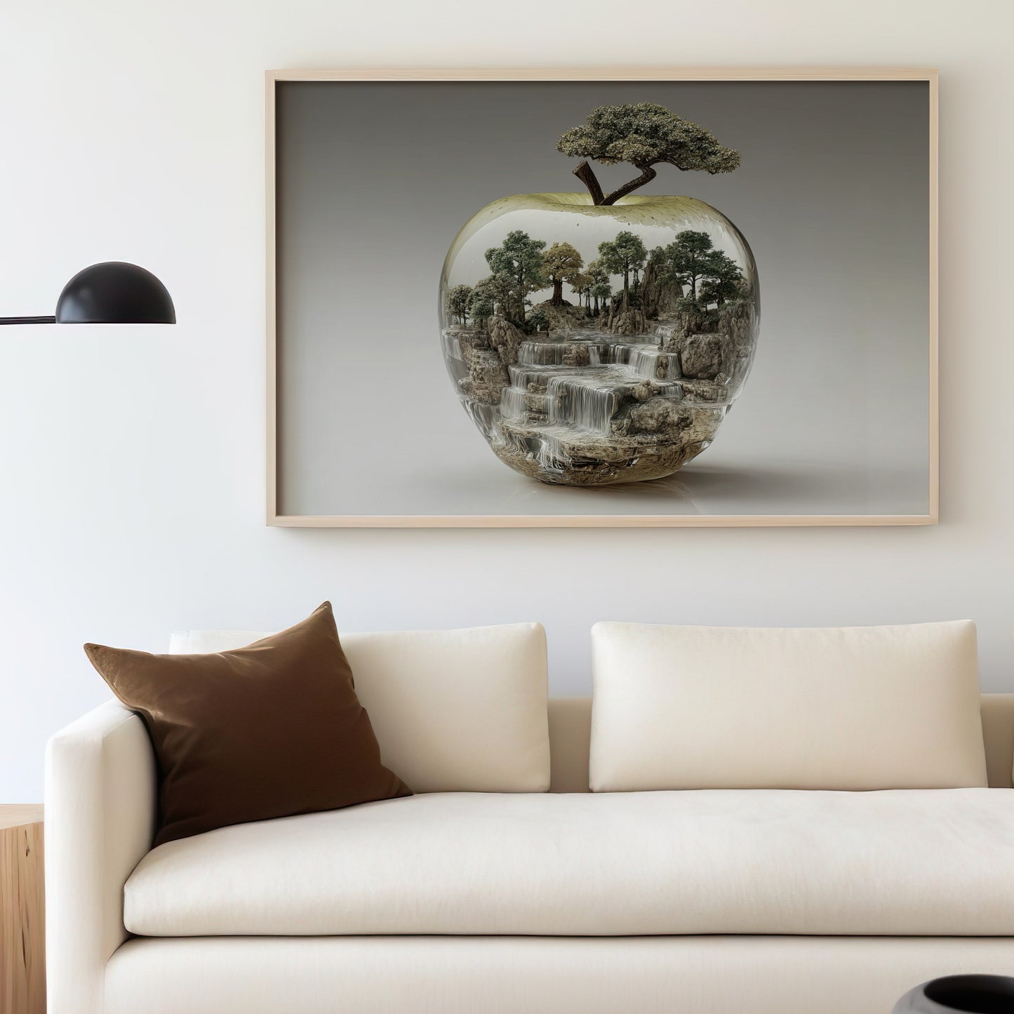 Framed artwork of a miniature landscape inside a clear apple with a waterfall.