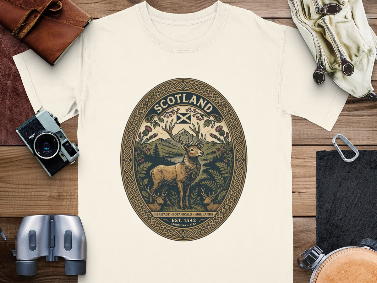 Cream t-shirt with oval graphic of a stag, highlands, and Scotland text.