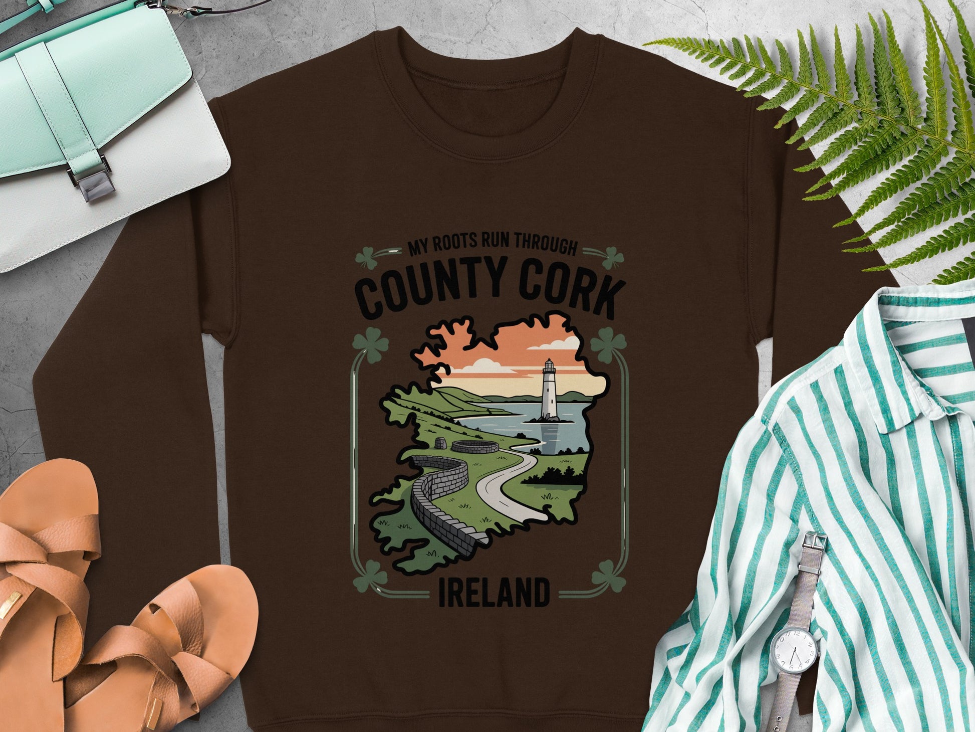 "County Cork Ireland" text and a lighthouse scenic map graphic on Dark Chocolate sweatshirt