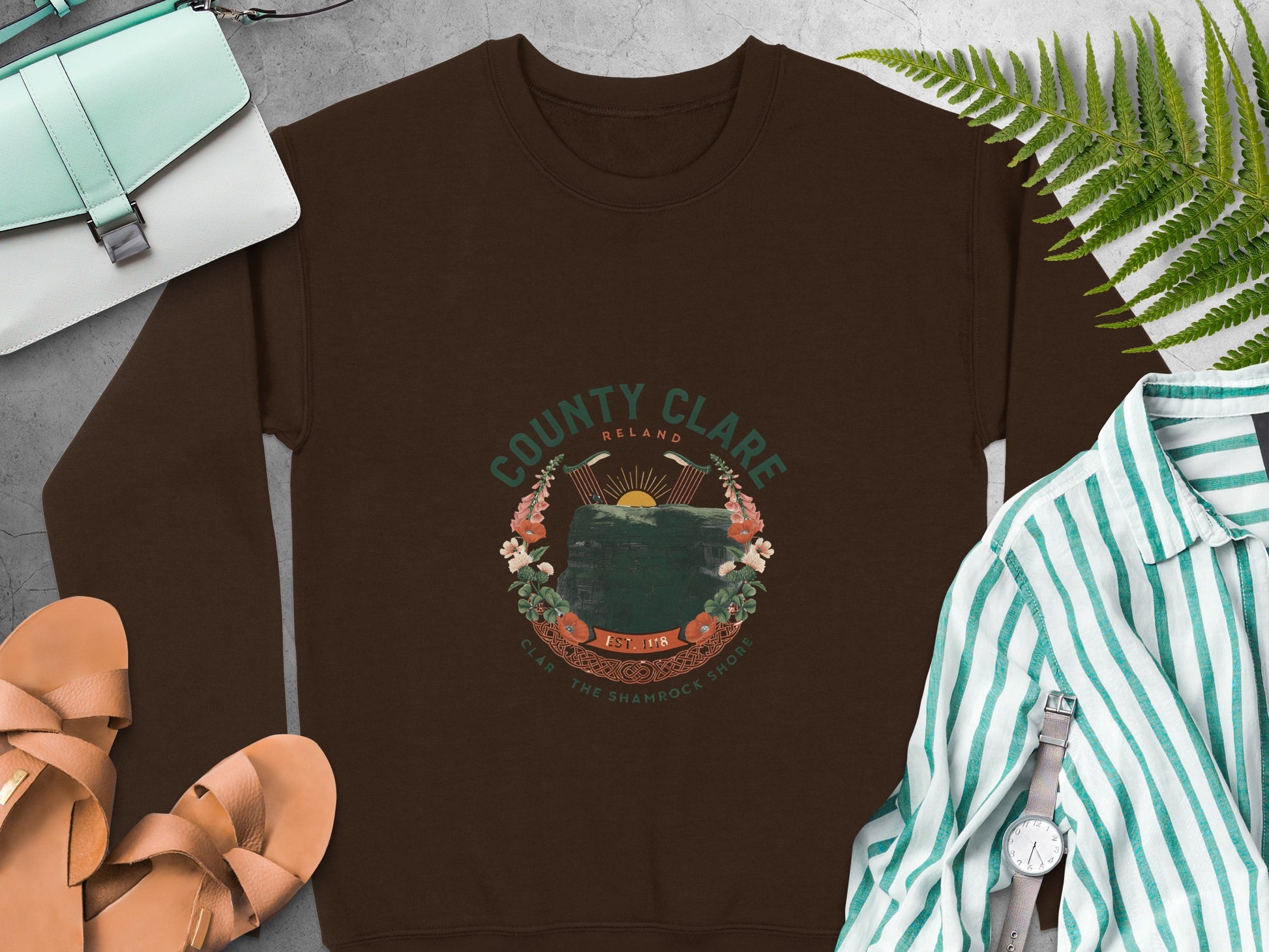 "County Clare Ireland" circular graphic featuring cliffs and flowers on Dark Chocolate sweatshirt