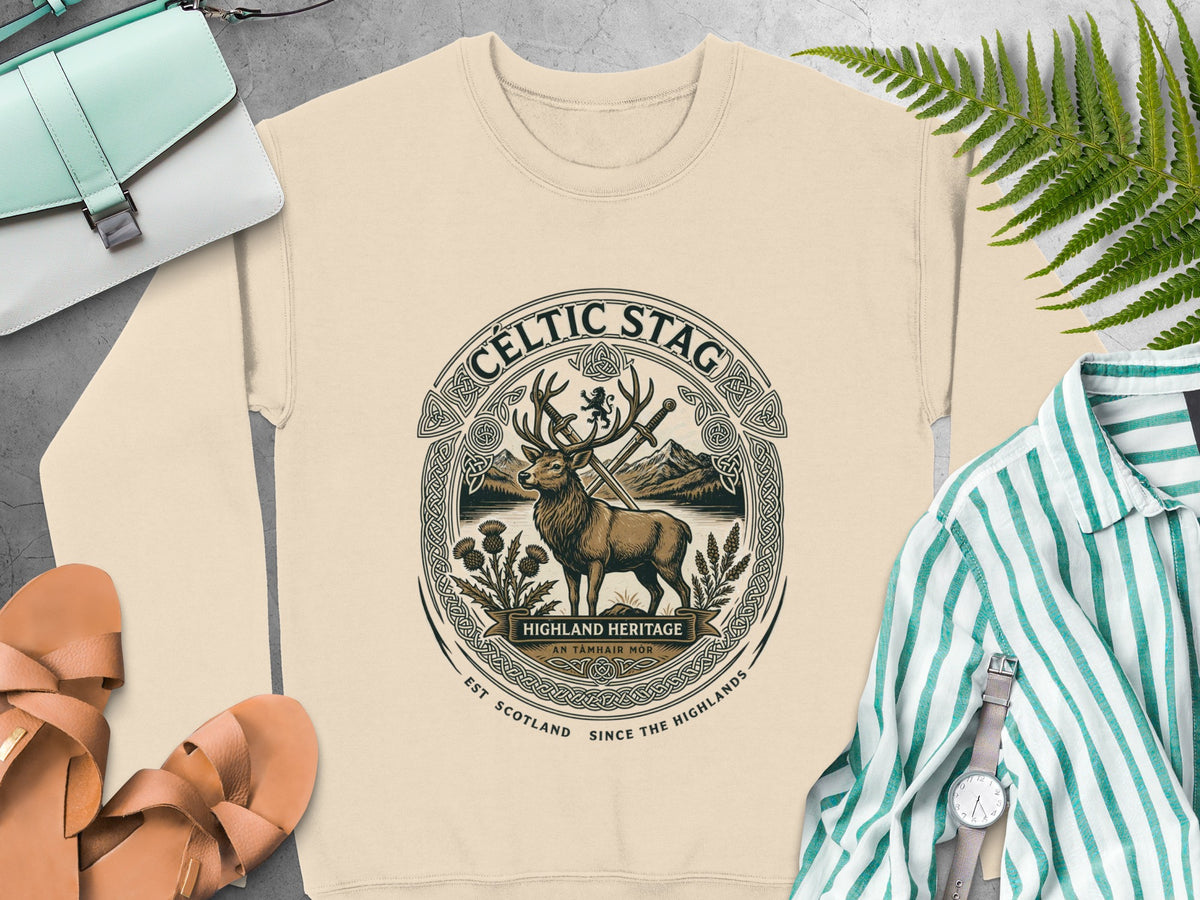 Cream sweatshirt with a Celtic stag emblem featuring mountains, thistles, and text.