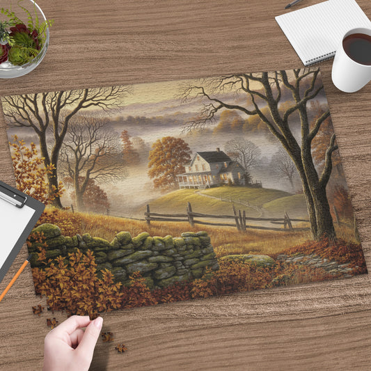 Autumn puzzle depicts a house on a hill with fallen leaves and stone wall.