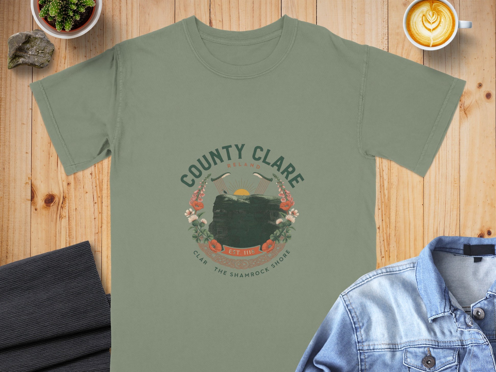Green t-shirt with "County Clare Ireland" circular graphic featuring cliffs and flowers.