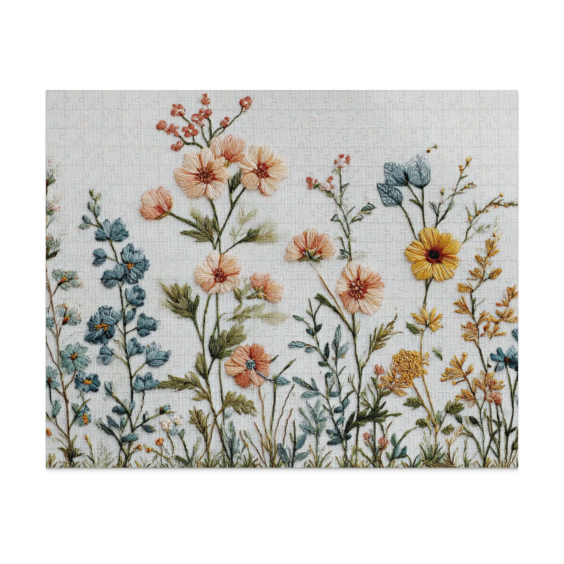 Embroidery of wildflowers and green stems on a textured white background.
