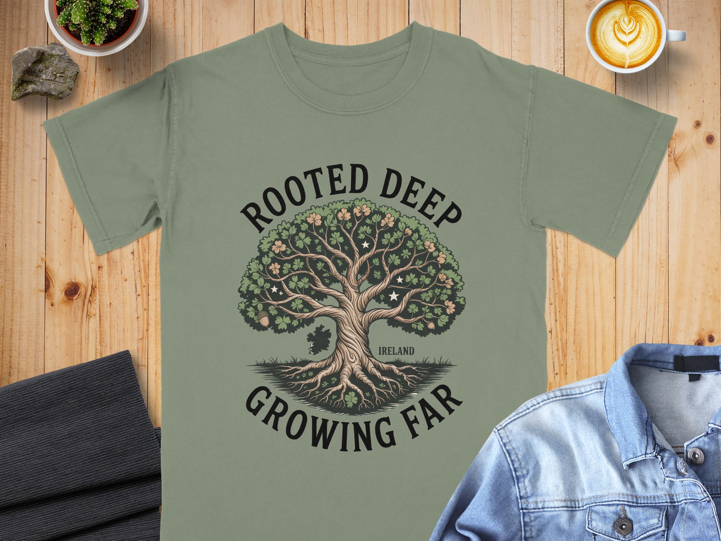 Green t-shirt with "Rooted Deep Growing Far" text and Ireland tree graphic.