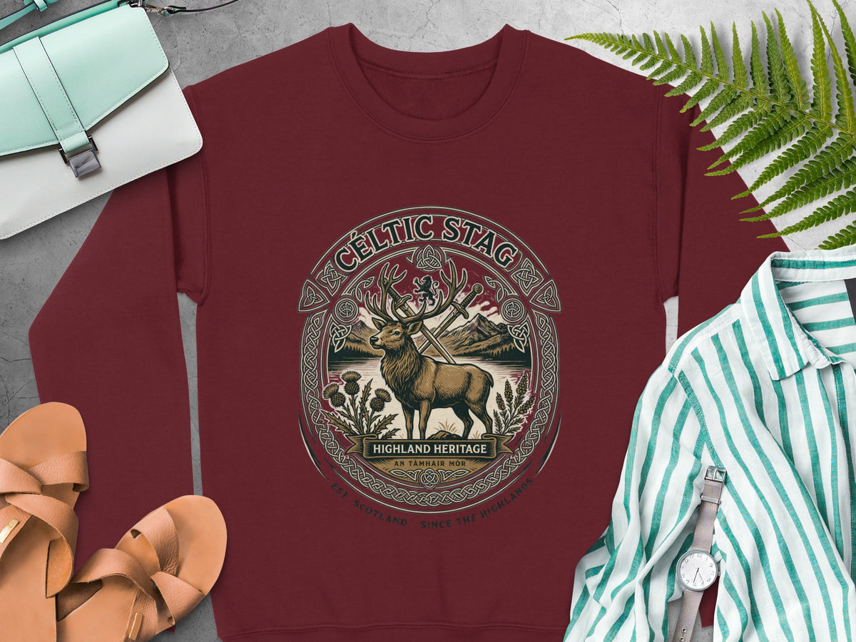 Burgundy sweatshirt with Celtic stag design and "Highland Heritage" text.