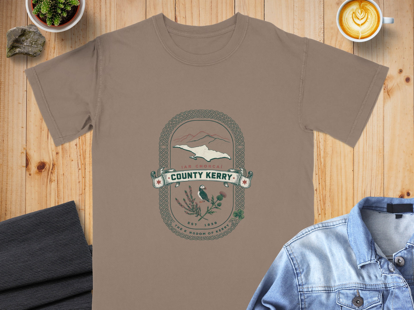 Brown t-shirt with County Kerry crest featuring puffin, thistles, and mountains.