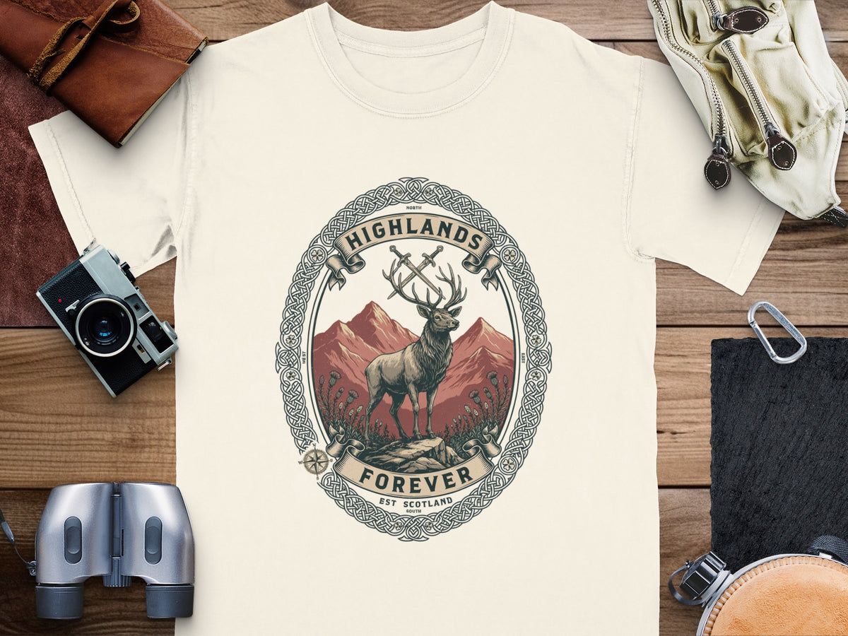T-shirt featuring a deer, swords, and mountains within a Celtic knot emblem.