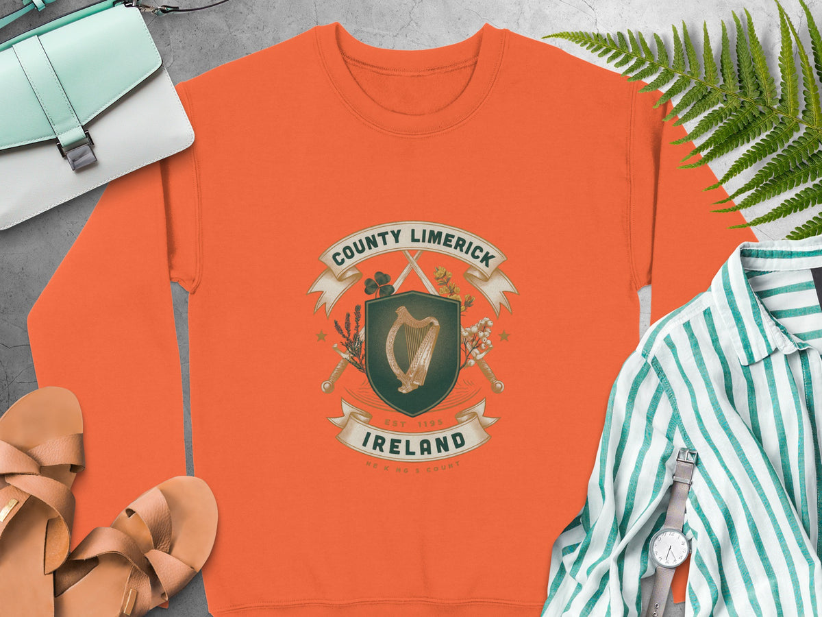 Orange sweatshirt with County Limerick Ireland crest featuring harp and crossed swords.