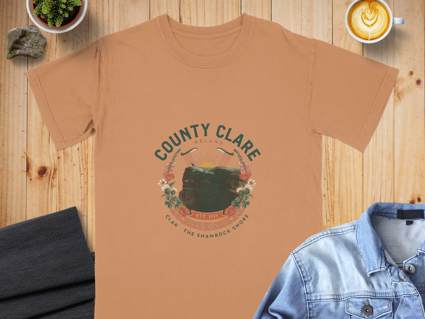 Orange t-shirt with "County Clare Ireland" graphic featuring cliffs and flowers.