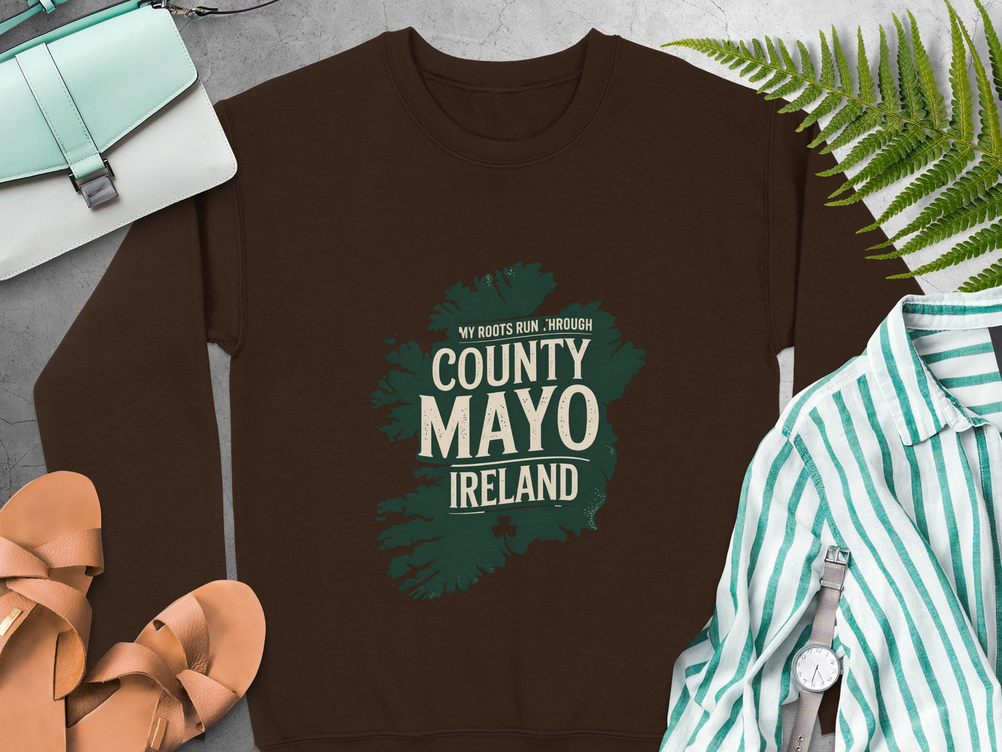 Brown sweatshirt with a green map outline of County Mayo, Ireland graphic.