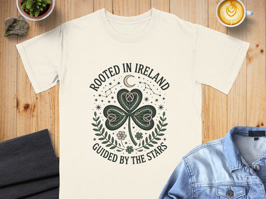Cream t-shirt with "Rooted in Ireland" and "Guided by the Stars" text around a shamrock.