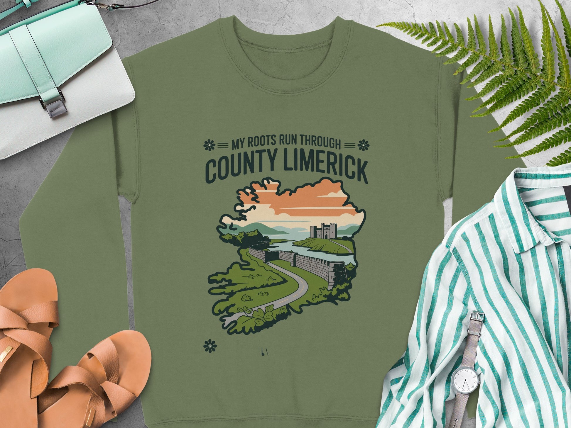 "County Limerick" map graphic, surrounded by accessories on Military Green sweatshirt