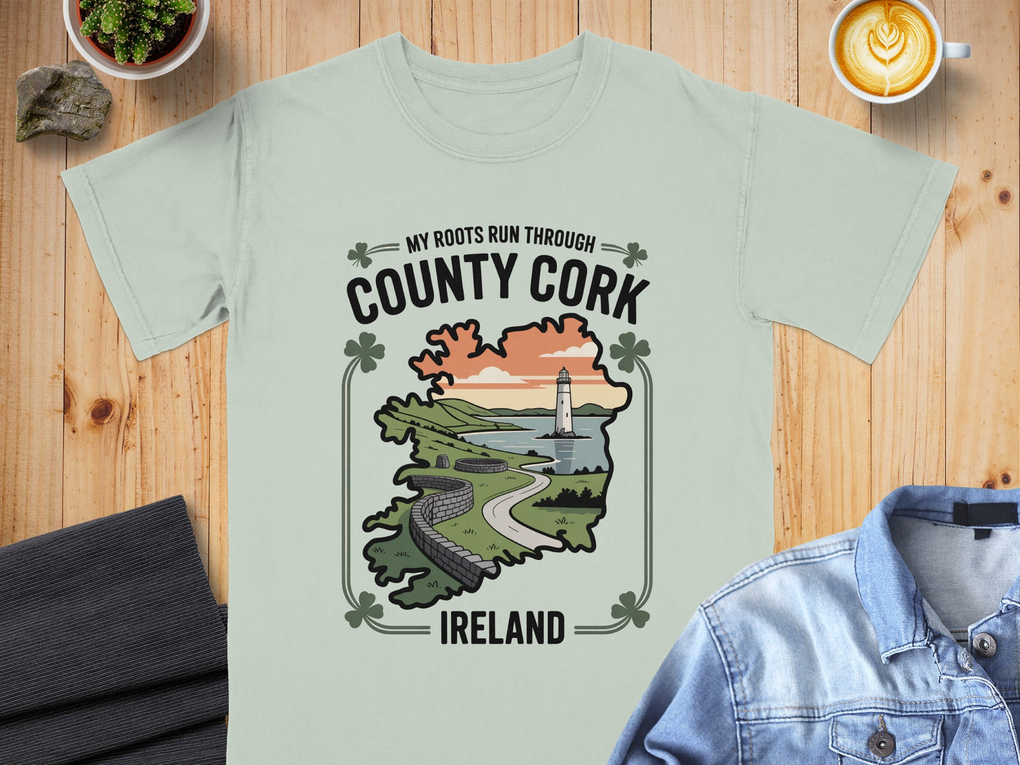 Light green t-shirt with "My Roots Run Through County Cork Ireland" and a landscape scene.